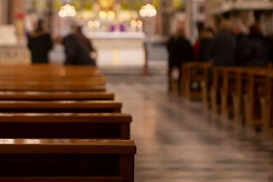 People In Chapel Blurred Focus