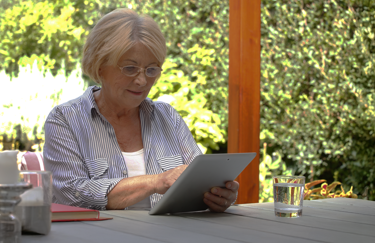 Lady Browsing Outdoors On Tablet