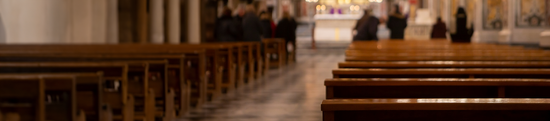Pews And People At Funeral Service