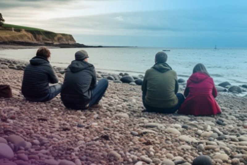 Family sat on beach