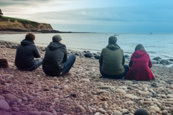 Family sat on beach
