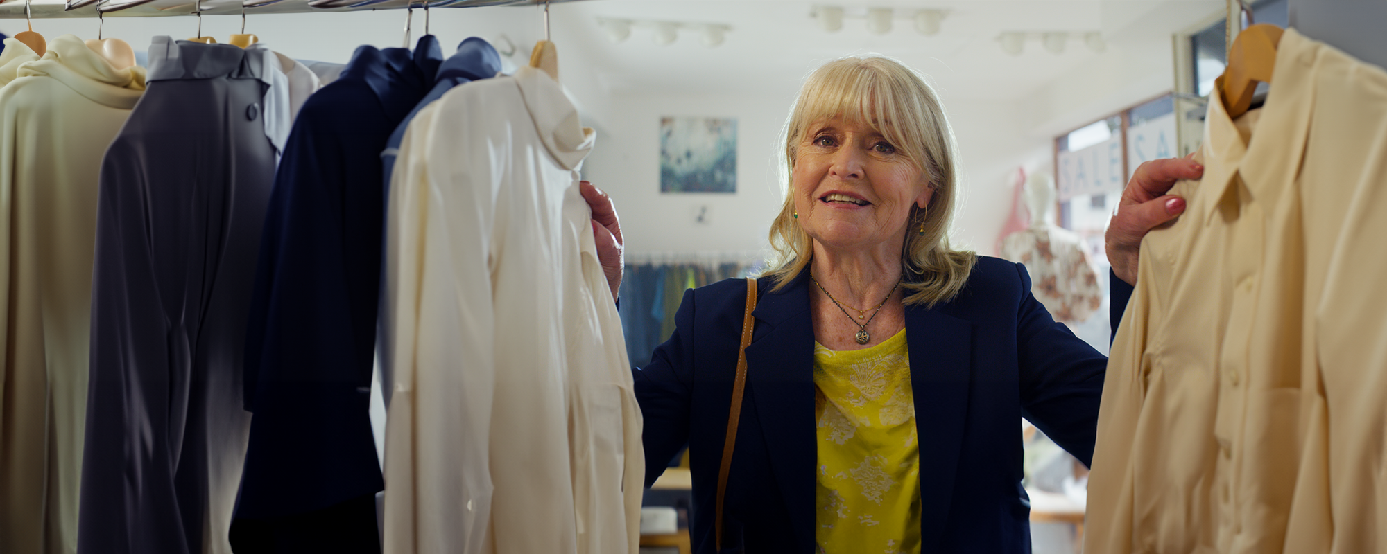Sue Cook With Clothes Rail From TV Advert