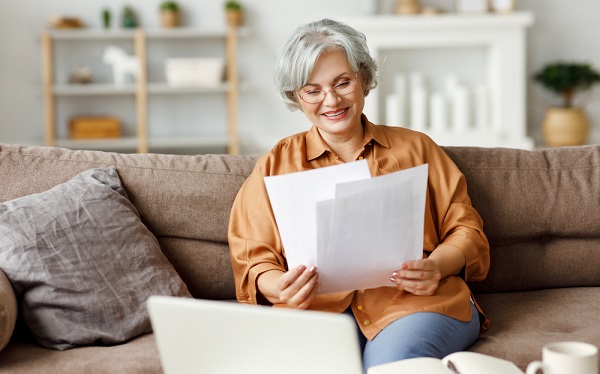 Woman smiling at papers