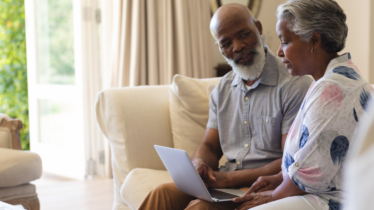 Elderly couple reviewing funeral prices _ Distinct Cremations