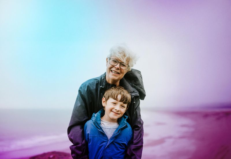Grandson and grandmother on beach