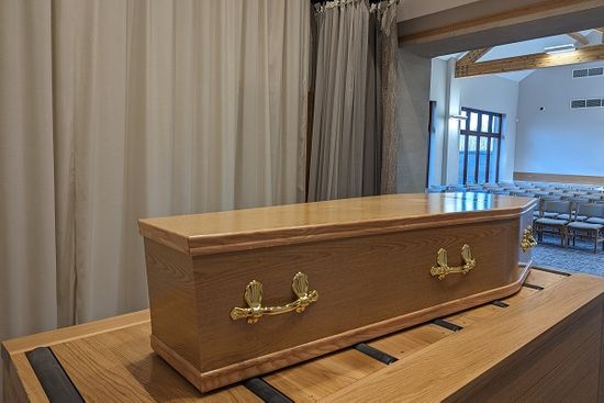 Coffin Resting In Empty Chapel