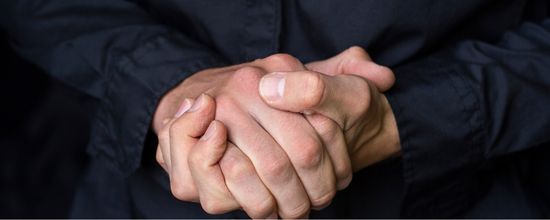 Funeral Celebrant With Clasped Hands