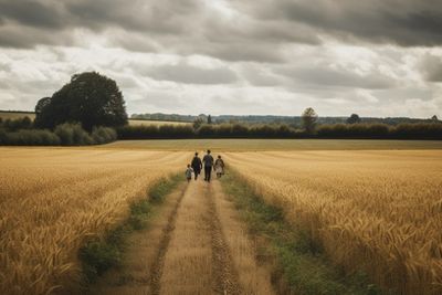 Family Walking In Fields