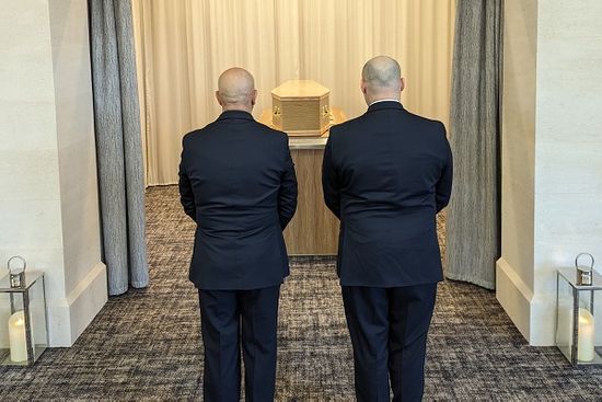 Funeral Operatives With Coffin At Direct Cremation