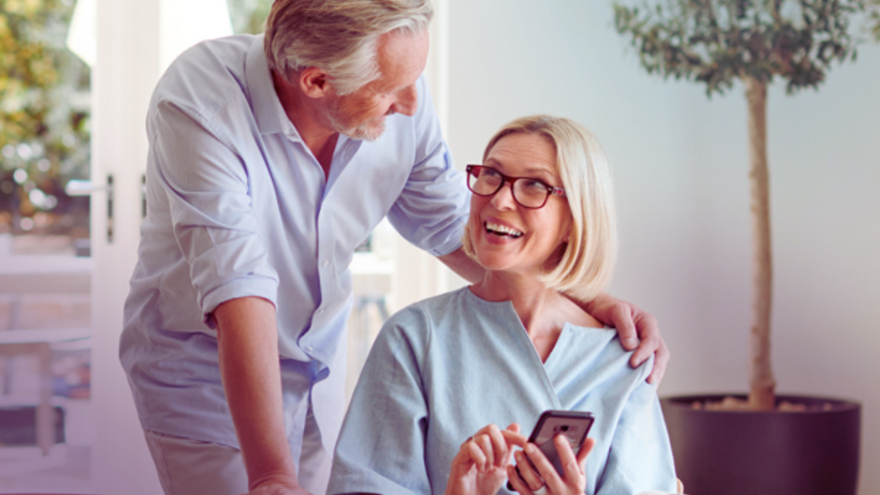 Smiling couple on phone