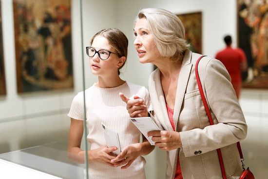 Older Lady And Teenage Girl In Gallery