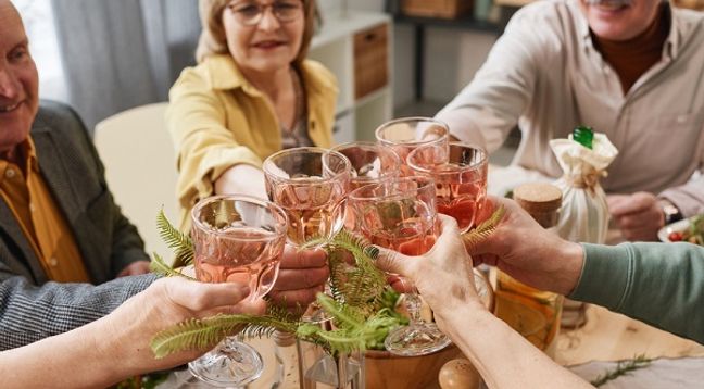 Group toasting a friend's memory