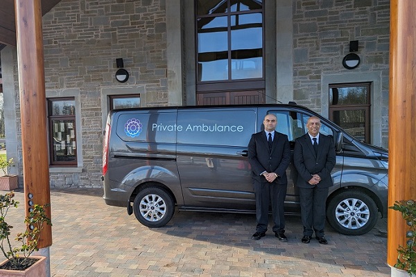 Funeral Operatives With Ambulance Outside Mercia Crematorium