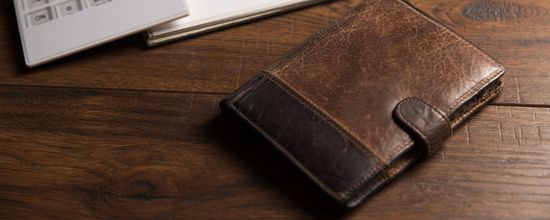 Wallet On Wooden Table