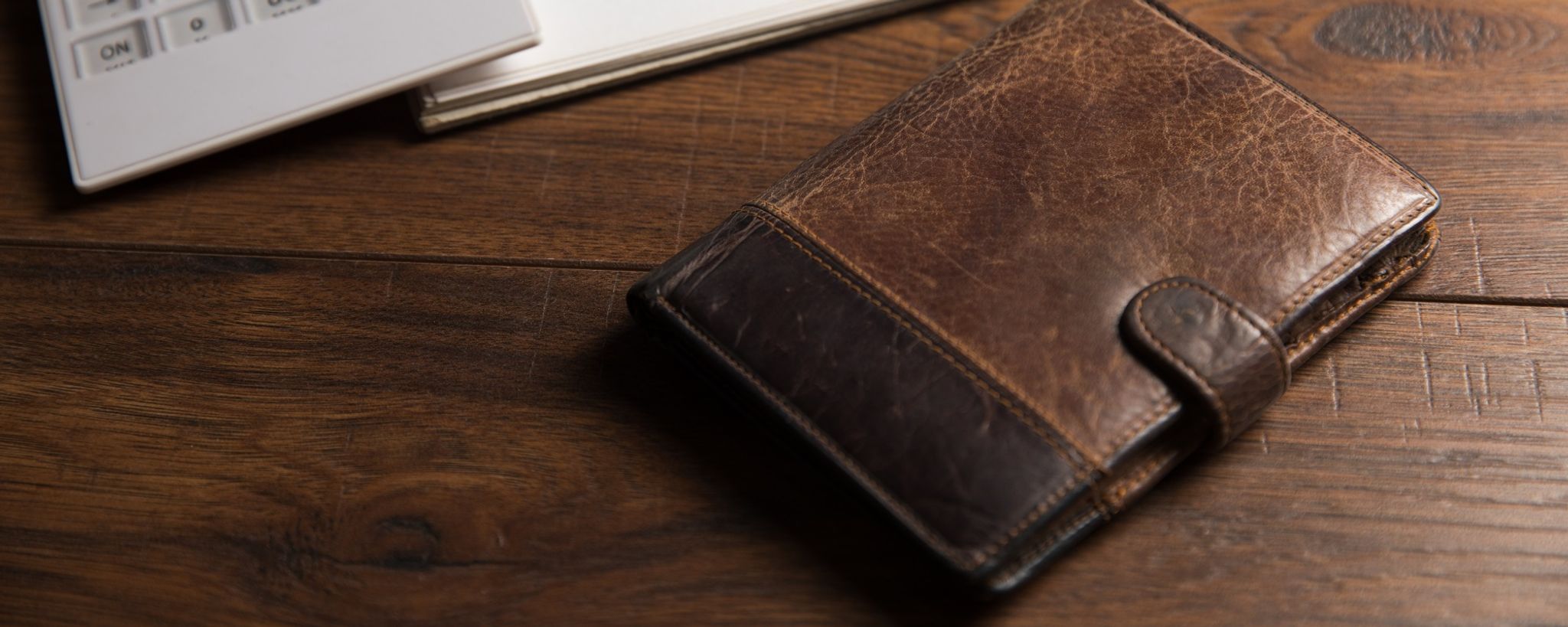 Wallet On Wooden Table