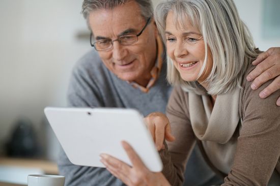 Older couple looking at tablet