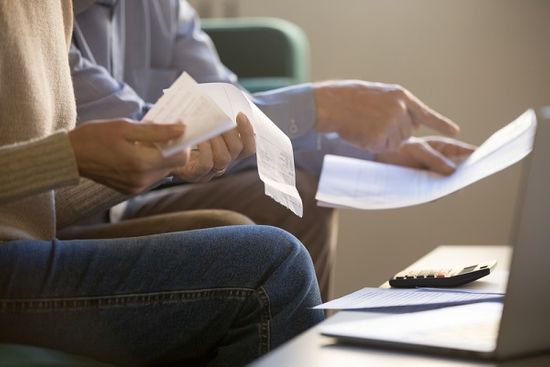 Couple reviewing finances for funeral plans