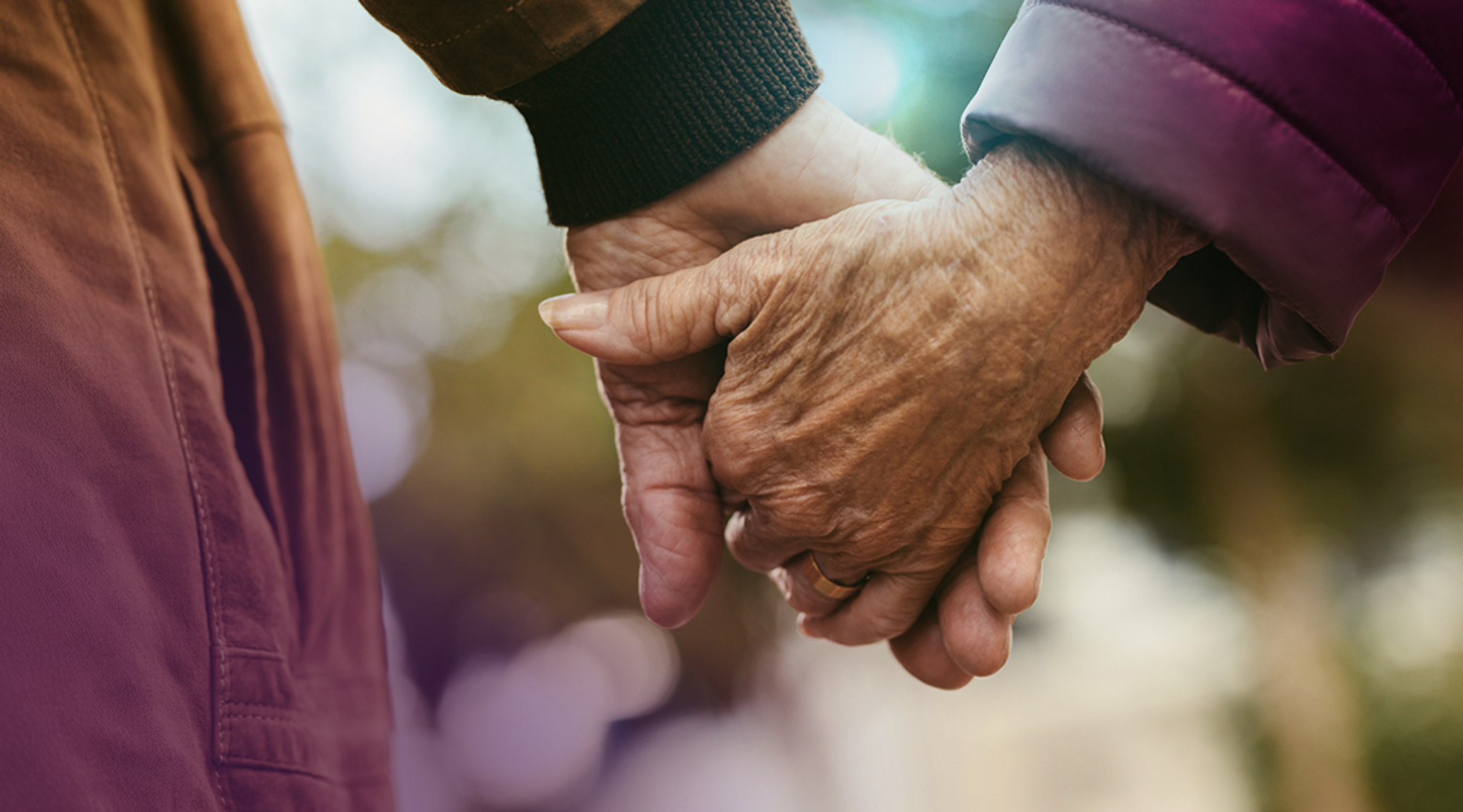 Older Couple Holding Hands Mobile Banner
