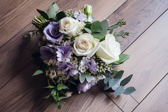 Purple And White Funeral Sheaf On Wooden Surface