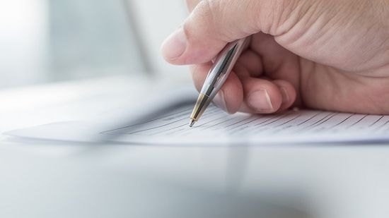 Man filling out paperwork